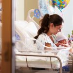 Mother,With,New,Born,Baby,In,Post,Natal,Department
