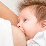 Close,Up,Mother,Breastfeeding,Her,Newborn,Child.