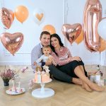 Family,Celebrating,First,Birthday,Party,Their,Daughters.,Cute,Girl,Celebrating