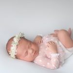 Adorable,Newborn,Baby,Girl,With,A,Magic,Flowers,Headband,Sleeps