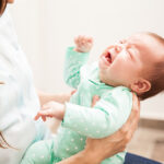 Portrait,Of,A,Cute,Newborn,Baby,Crying,In,Front,Of