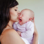The,Little,Two-month,Girl,Cries,At,The,Mother,On,Hands.