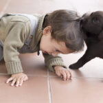 Portrait,Of,Adorable,Baby,And,His,Dog,At,Home