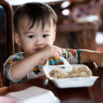 Cute,Little,Boy,Is,Eating,Food,Happily.,Child,Happily,Eats