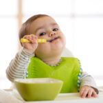 Happy,Infant,Baby,Boy,Spoon,Eats,Itself