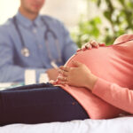 Pregnant,Woman,With,Doctor,At,Hospital
