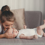 Little,Sister,Hugging,Her,Newborn,Brother.,Toddler,Kid,Meeting,New