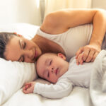 Side,View,Of,Beautiful,Young,Mom,And,Her,Cute,Little