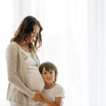 Portrait,Of,Beautiful,Pregnant,Woman,And,Her,Cute,Child,,Isolated