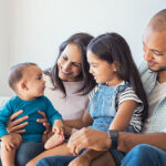 Multiethnic,Family,Playing,With,Happy,Baby,Son,At,Home.,Parent