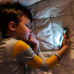 Cute,Little,Boy,Using,A,Smartphone.,Kid,Playing,With,Mobile