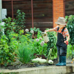 Portrait,Of,A,Boy,Working,In,The,Garden,In,Holiday