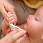Baby,Getting,Fingernails,Cut,While,Sleeping,By,His,Mother,With