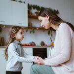 Mom,With,A,Little,Daughter,In,The,Kitchen.,The,Girl