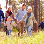 Happy,Multi-generation,Family,Walking,In,The,Countryside