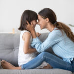 Loving,Mom,Laughing,Caressing,Touching,Noses,With,Cute,Kid,Daughter