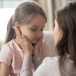 Loving,Young,Mother,Touching,Upset,Little,Daughter,Face,,Expressing,Support,