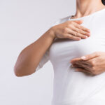 Woman,Hand,Checking,Lumps,On,Her,Breast,For,Signs,Of
