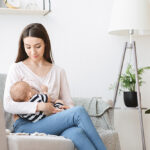 Lactation,Concept.,Beautiful,Young,Mother,Breastfeeding,Newborn,Baby,On,Couch