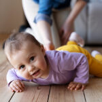 baby-crawling-with-his-mother-s-help