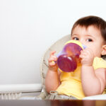 Cute,Baby,Infant,Boy,Girl,Sitting,In,Chair,Drinking,From