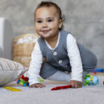 cute-baby-crawling-playing-floor-with-toys