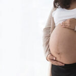 Asian,Mom,Take,Care,And,Holding,Belly,Feel,Baby,In