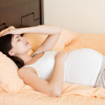 Beautiful,Young,Pregnant,Woman,Lying,In,Bed,,Top,View.,The