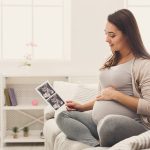 Pregnant,Woman,Looking,At,Her,Baby,Sonography.,Happy,Expectant,Lady