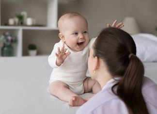 How do babies at 18 months explore language & expression