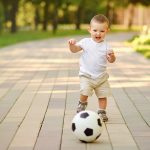 Happy,Toddler,Baby,Boy,Is,Playing,Walking,Behind,A,Soccer